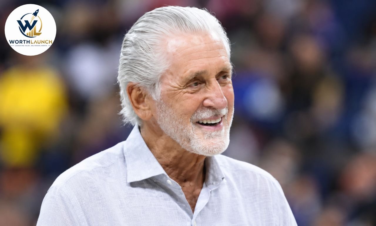 Chris Rodstrom with white hair and beard smiling at a sports event in a light-colored shirt.