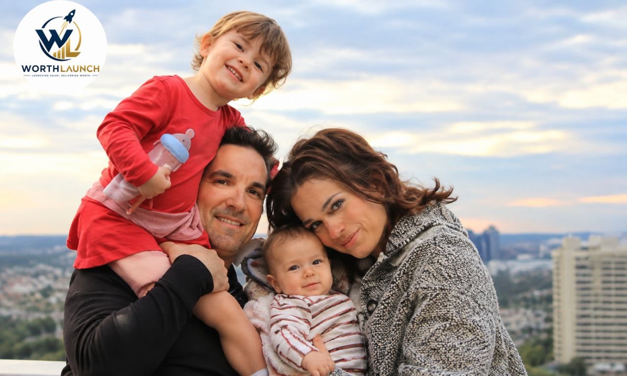 A happy family posing together with two children against a beautiful city skyline.