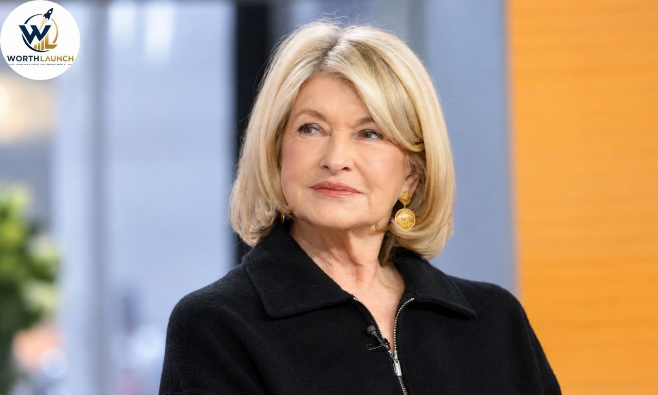 Martha Stewart in a black jacket and gold earrings during a television studio appearance.