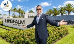 Misha Ezratti a suit standing outside the Lions Palm Boca Raton entrance.