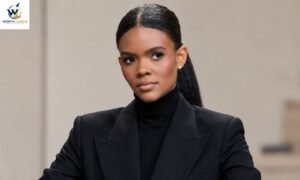 Professional Black woman in a black blazer and turtleneck posing against a neutral studio background.